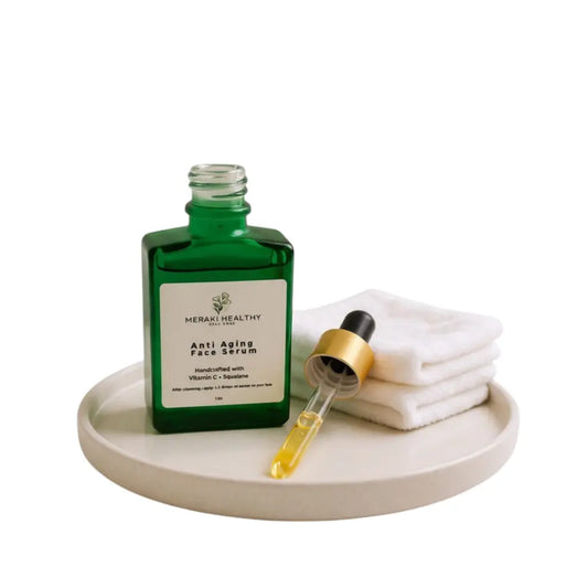 Meraki Healthy Anti-Aging Face Serum bottle on clean background. Lightweight botanical serum formulated with squalane, rosehip oil, green tea, and vitamin C to hydrate, smooth, and brighten skin. Reduces fine lines, dark spots, and dullness while improving texture and glow. Vegan, cruelty-free, and suitable for all skin types.